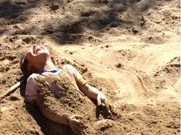 Buried-in-sand-at-the-beach.jpg